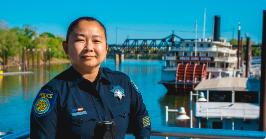 Police officer at Sacramento river riverfront dock.