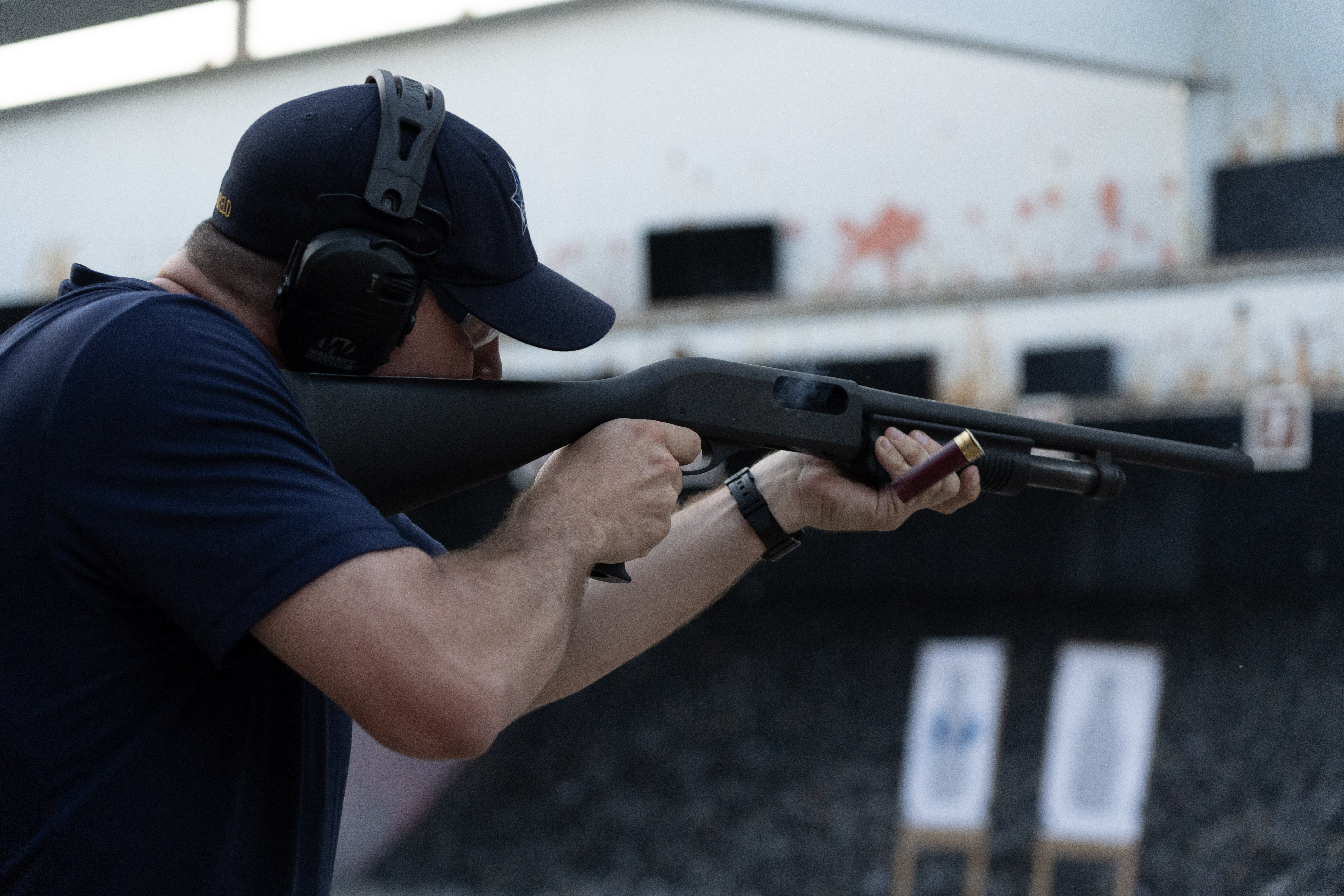 A photo of a Sacramento Police Department officer aiming a shotgun at the gun range